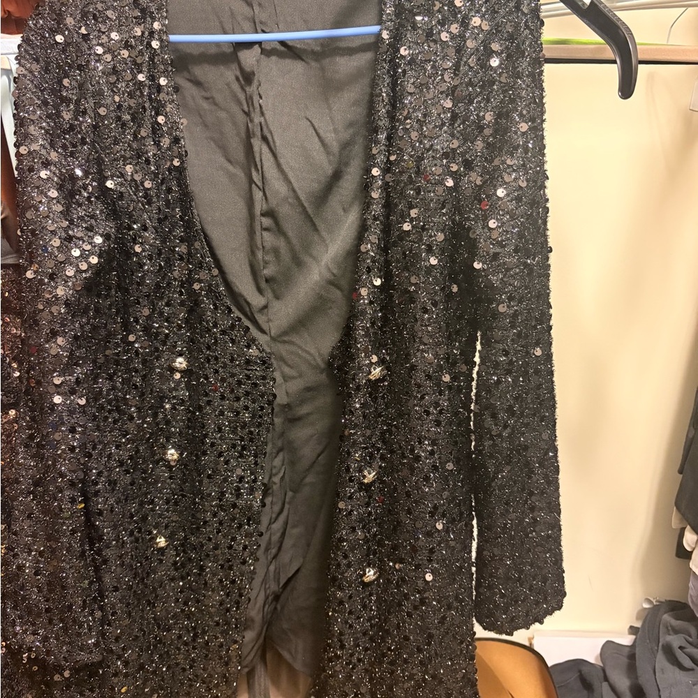 Black elegant sequined blazer. Can be dressed up or down.